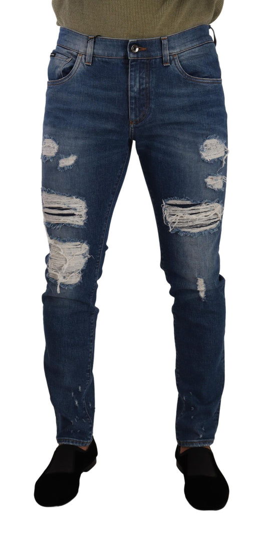 Pair of distressed blue jeans with holes and rips