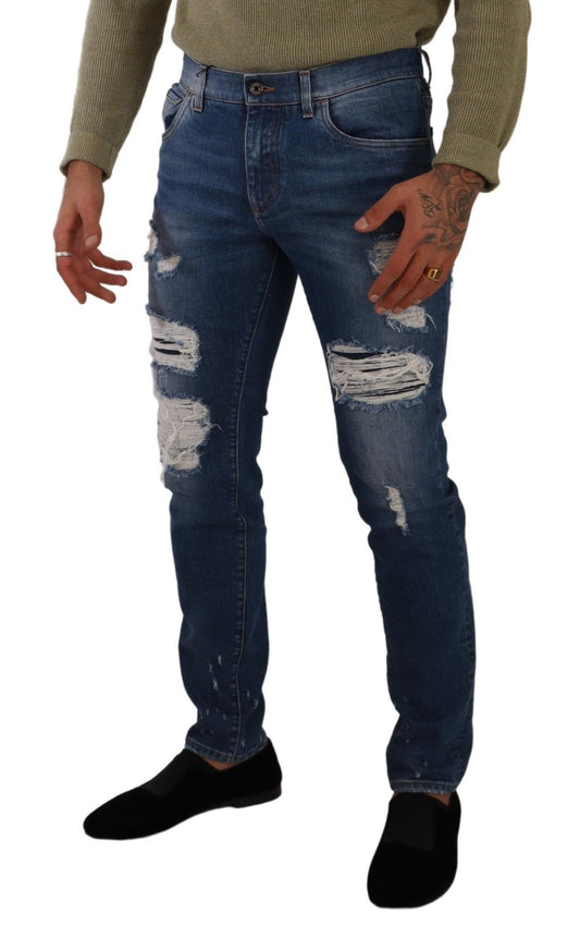 Man wearing blue jeans with holes and rips