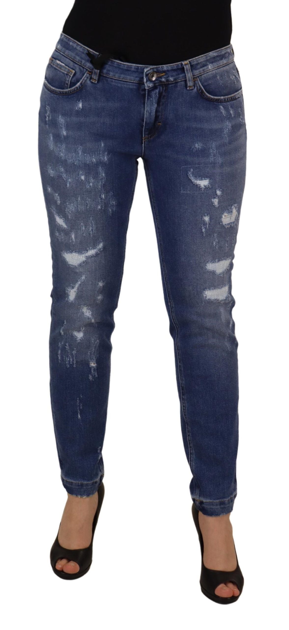 Pair of blue denim jeans with distressed design