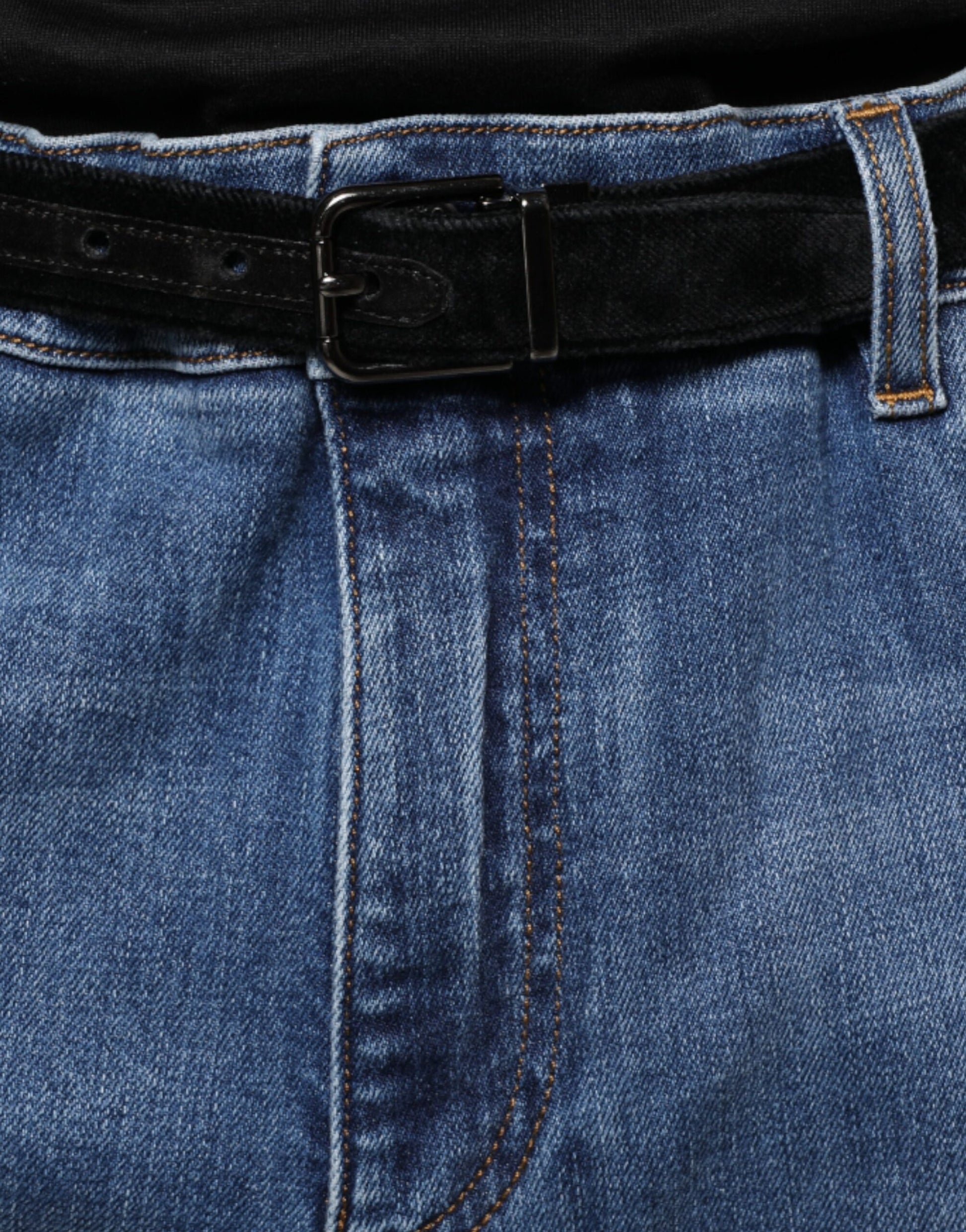 Pair of blue jeans with belt loops and a visible belt