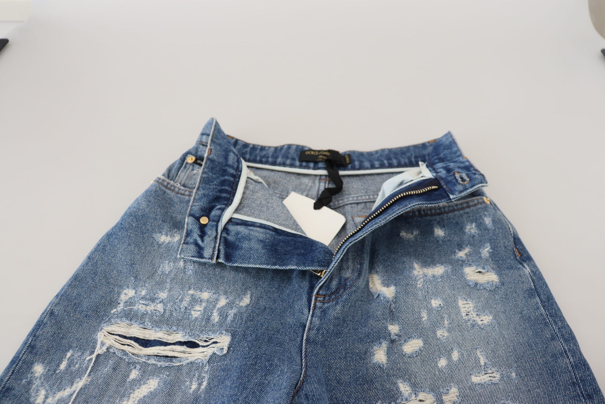 Blue denim shorts with distressed design