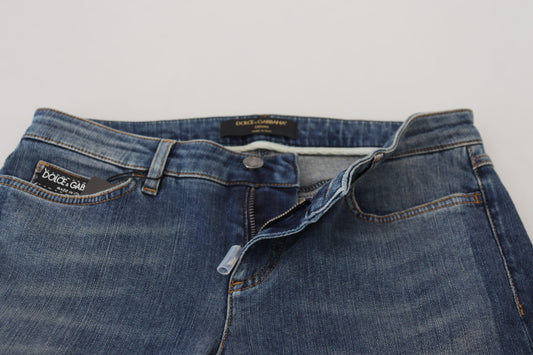 Blue denim jeans with a split seam at the crotch area