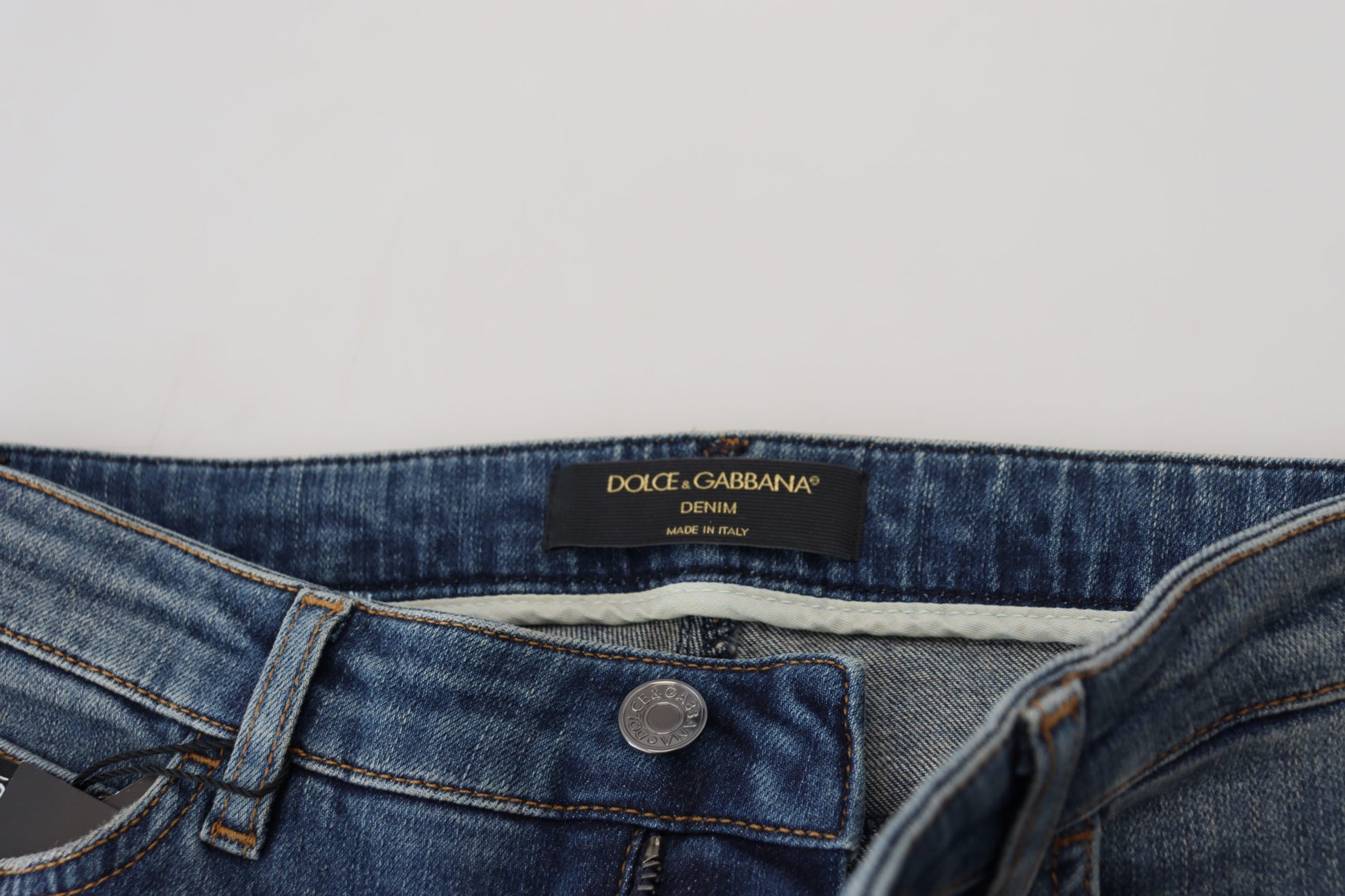 Blue denim jeans with brand label on waistband
