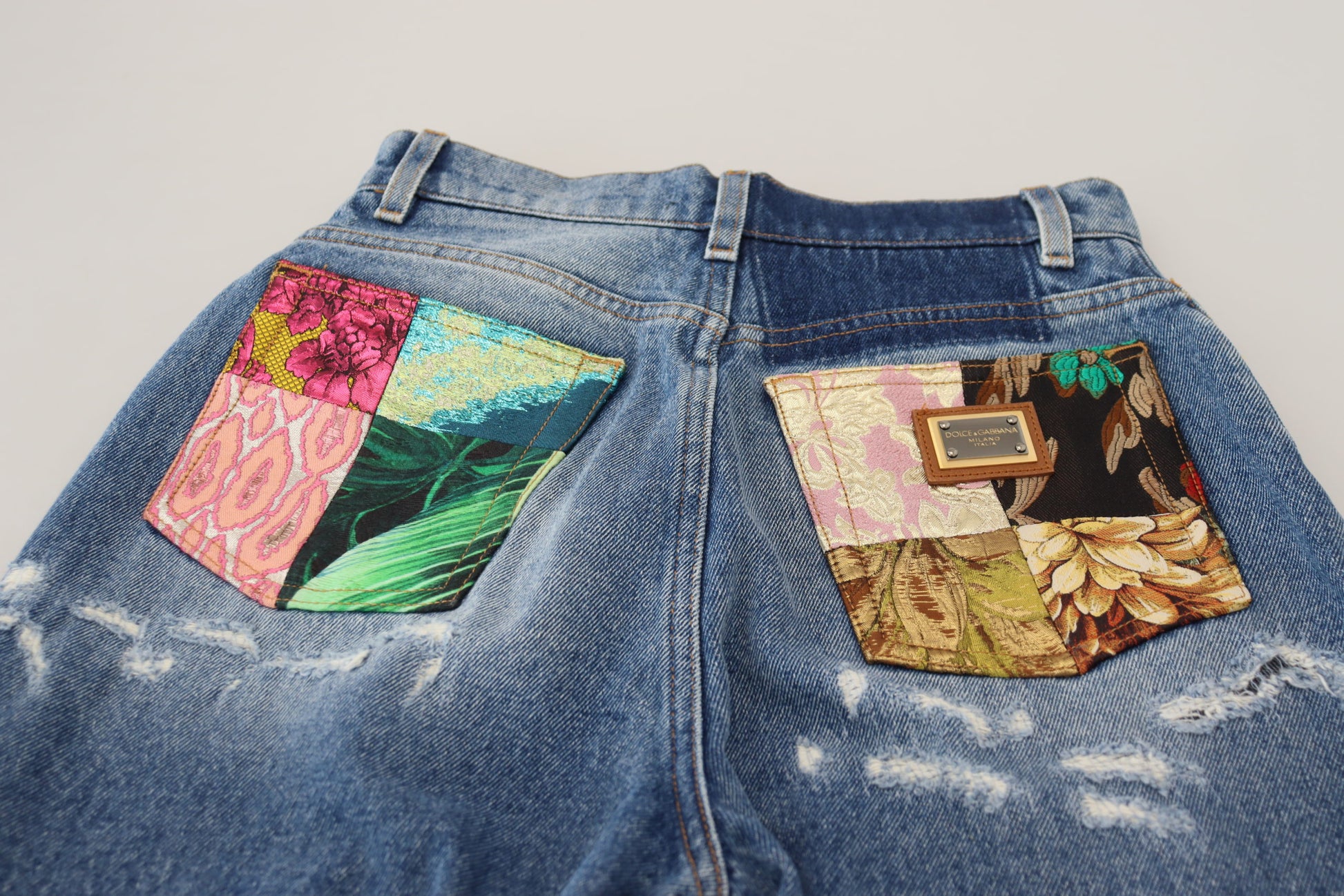 Pair of jeans with colorful patches on pockets