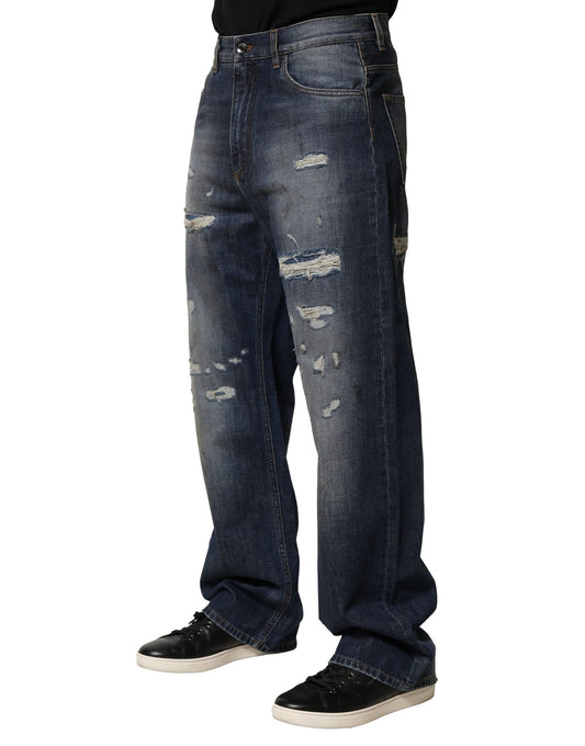 Man wearing blue jeans with holes in them