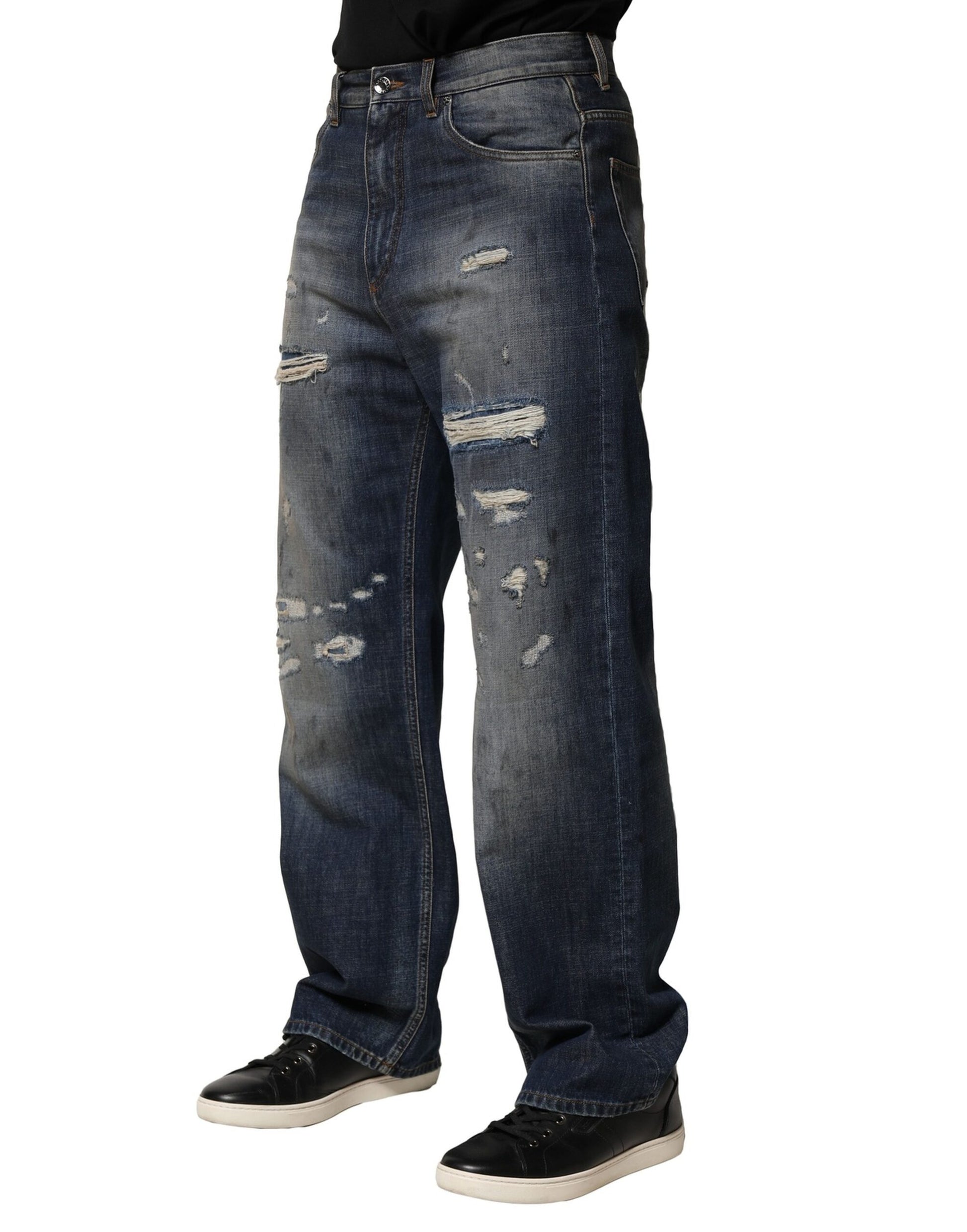 Pair of blue jeans with holes in knees
