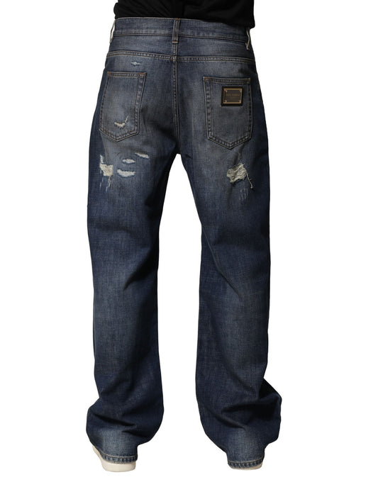Pair of blue denim jeans with distressed areas