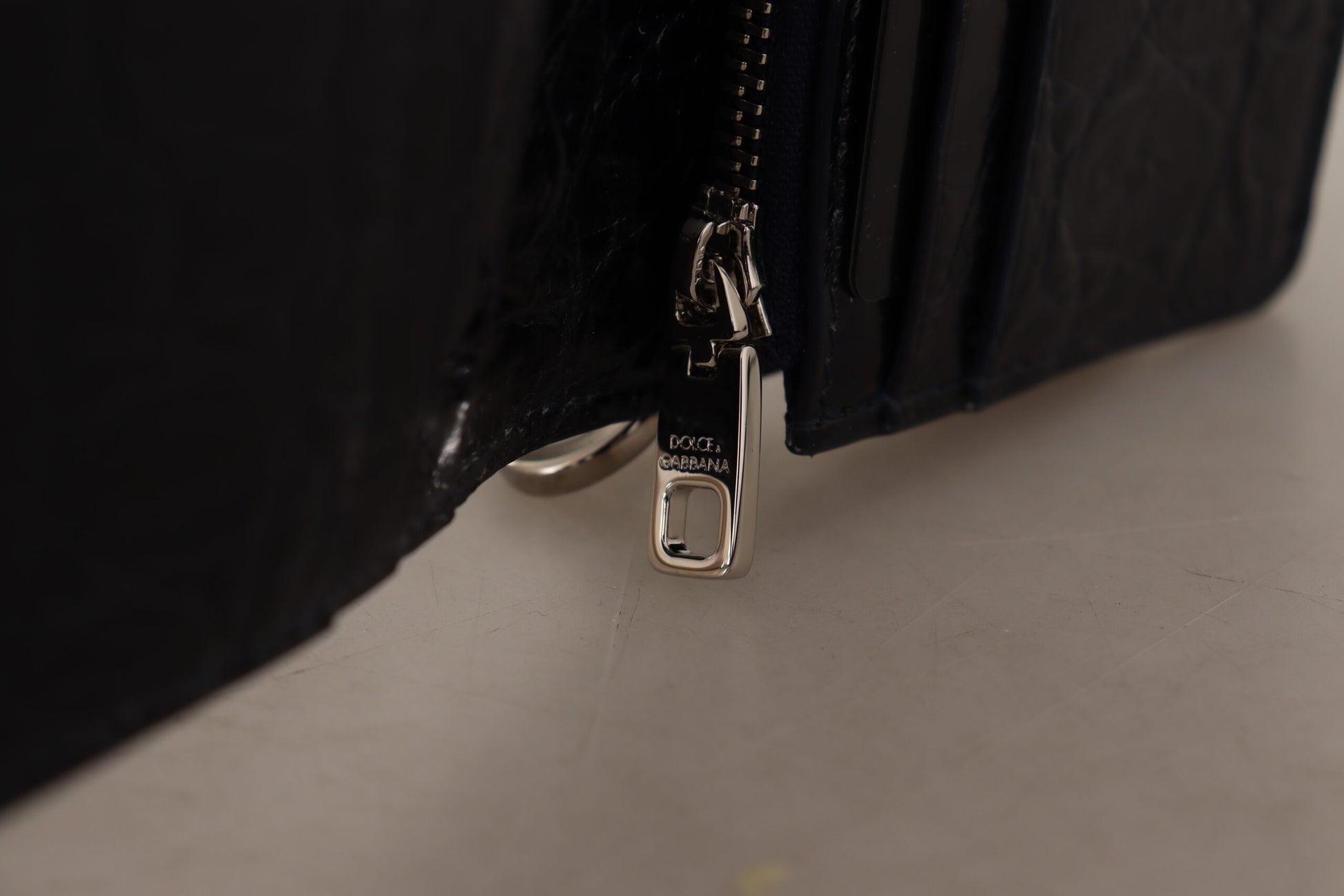 Zipper on a black leather purse