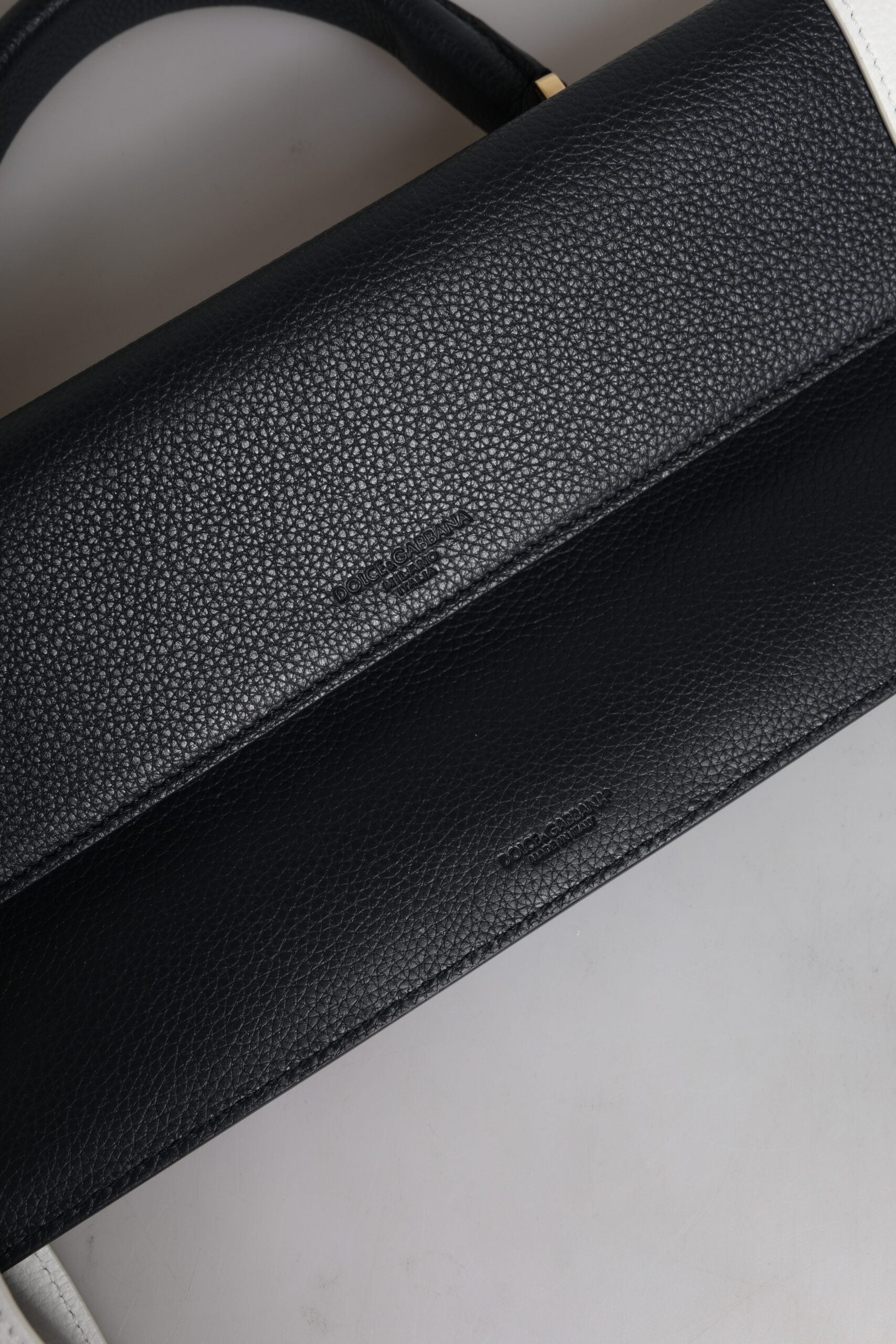 Black leather wallet on table