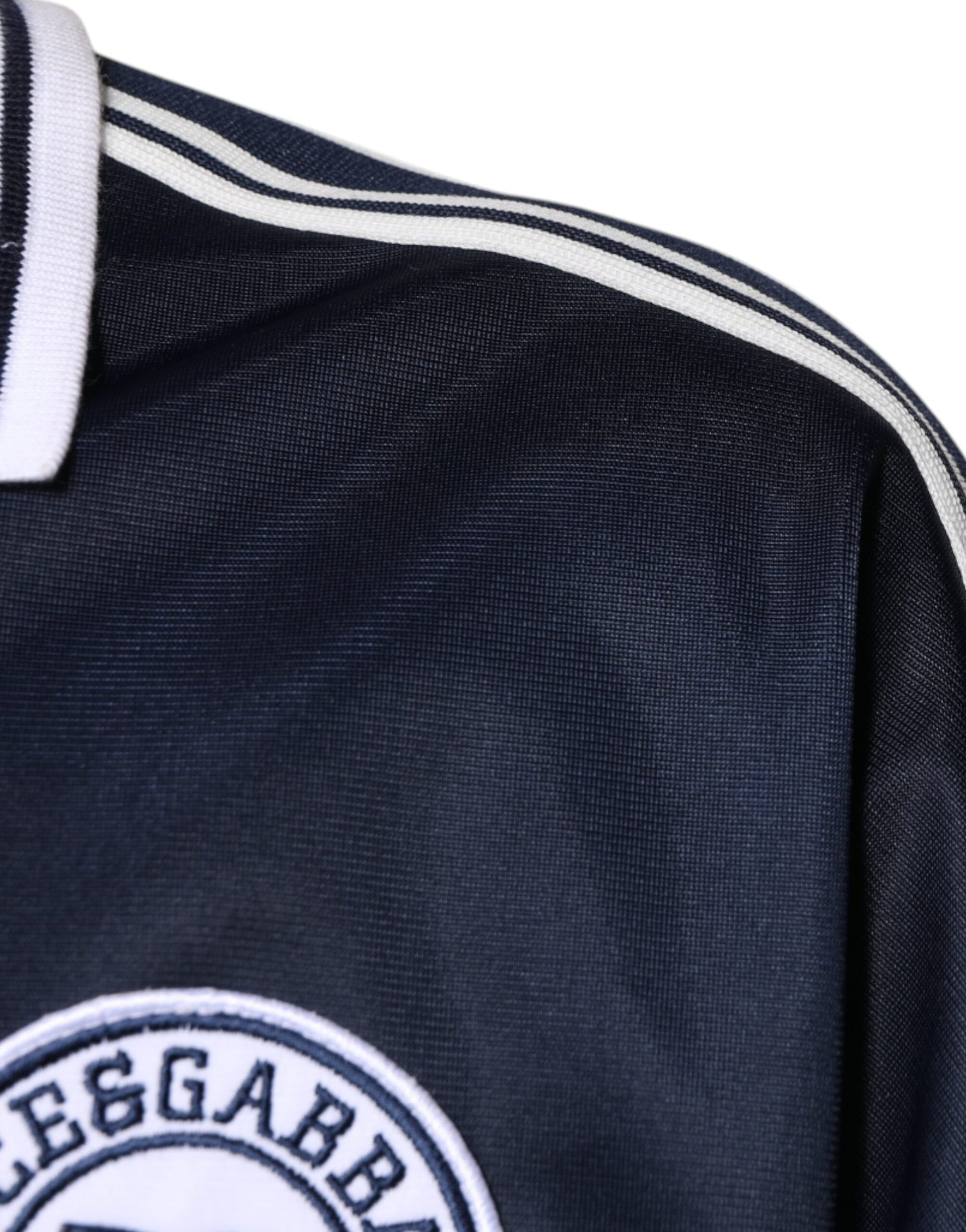 Blue soccer jersey with white stripes on sleeves