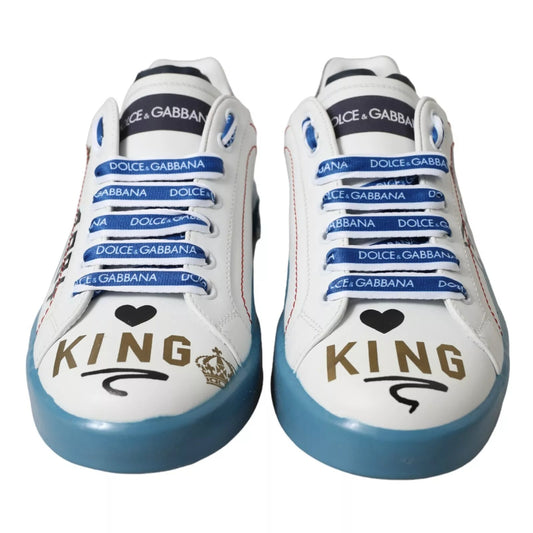 Pair of blue and white sneakers with brand logos and King written on side