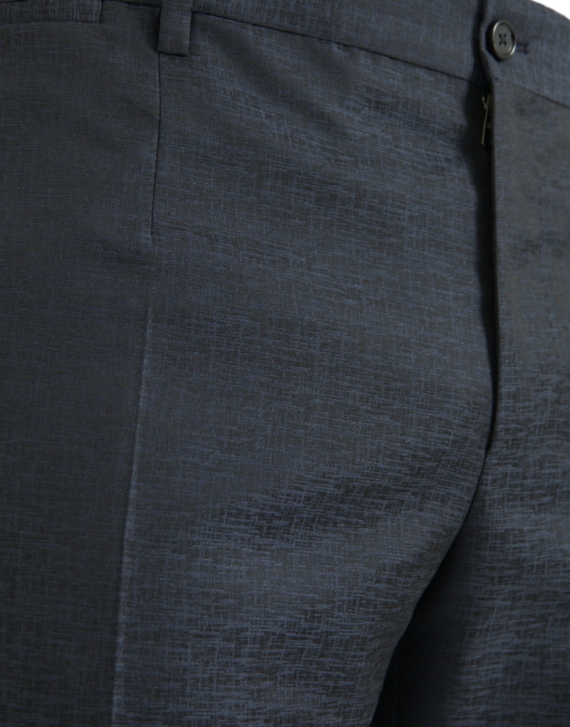 A pair of men's skinny dress pants in blue wool fabric. They feature a textured pattern and are designed with