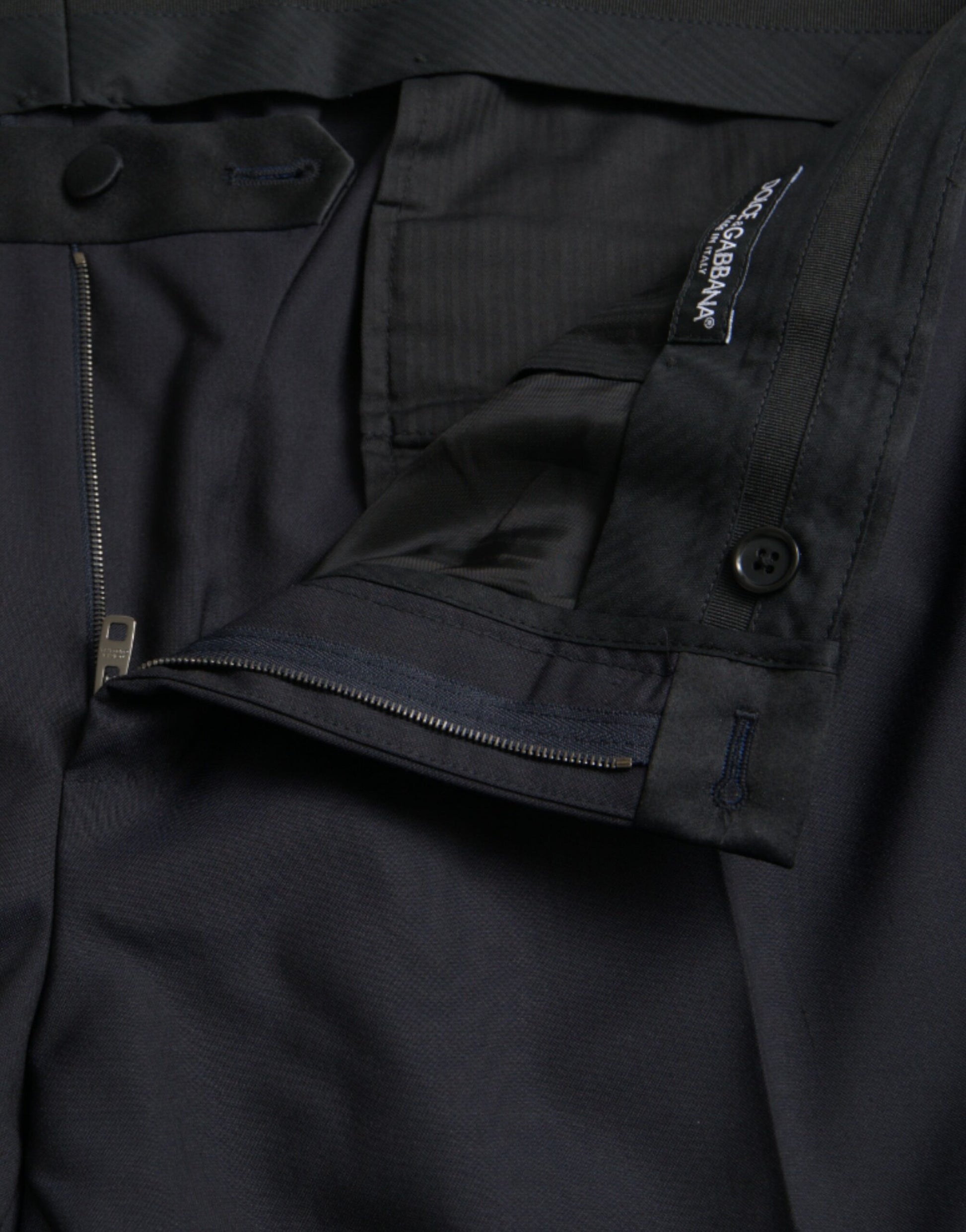 Black wool dress pants with zippered front, side pockets and buttoned back pocket