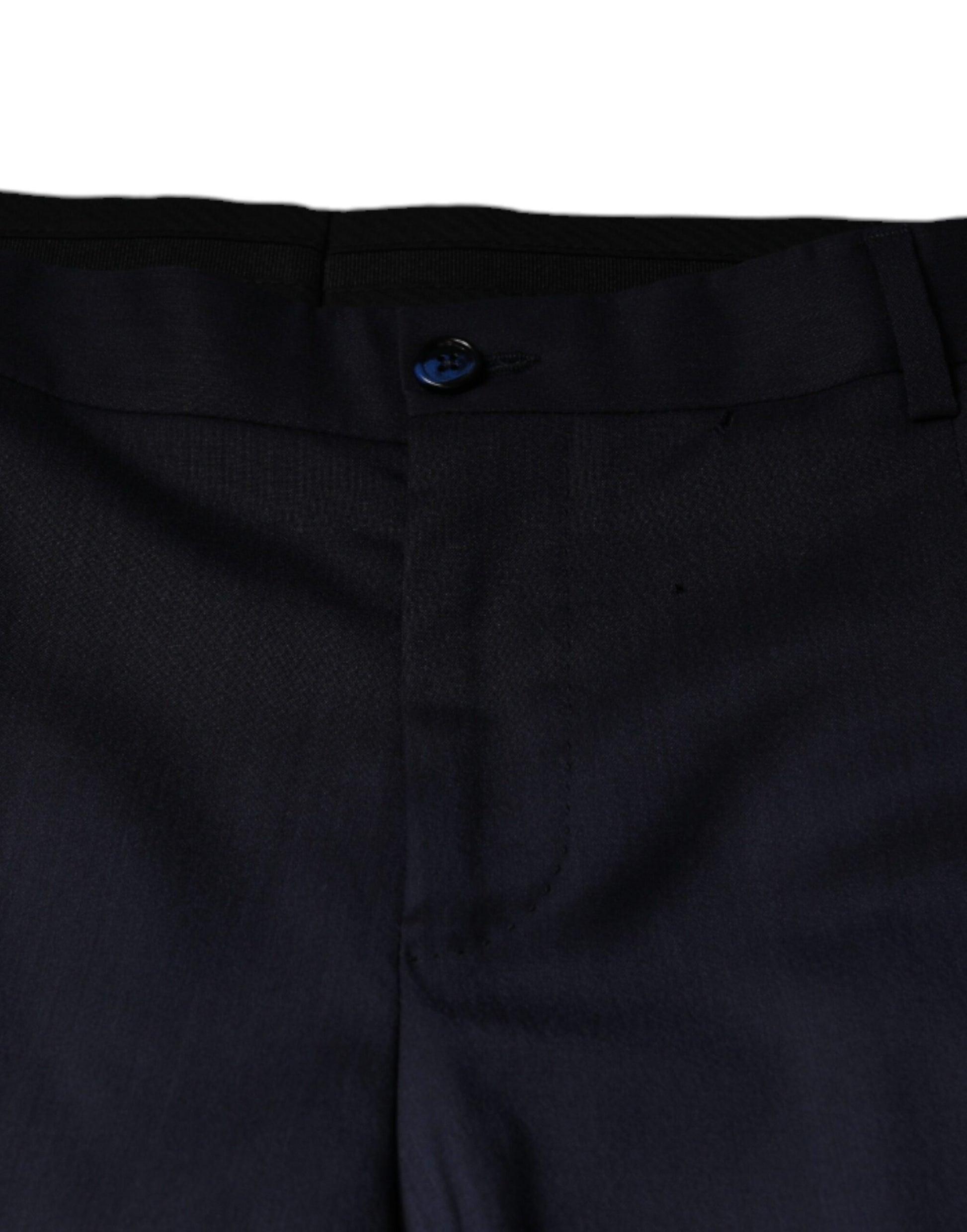 A pair of men's formal dress pants in a dark blue wool fabric. They feature a skinny fit and are designed by