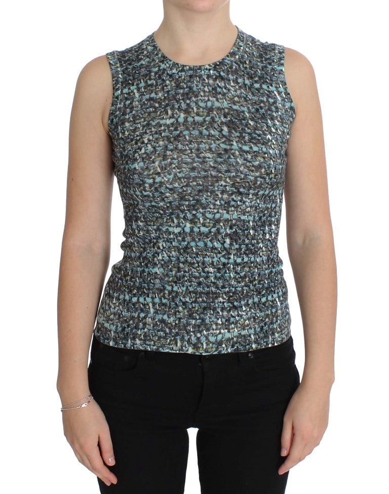 Woman wearing a crocheted vest over black pants