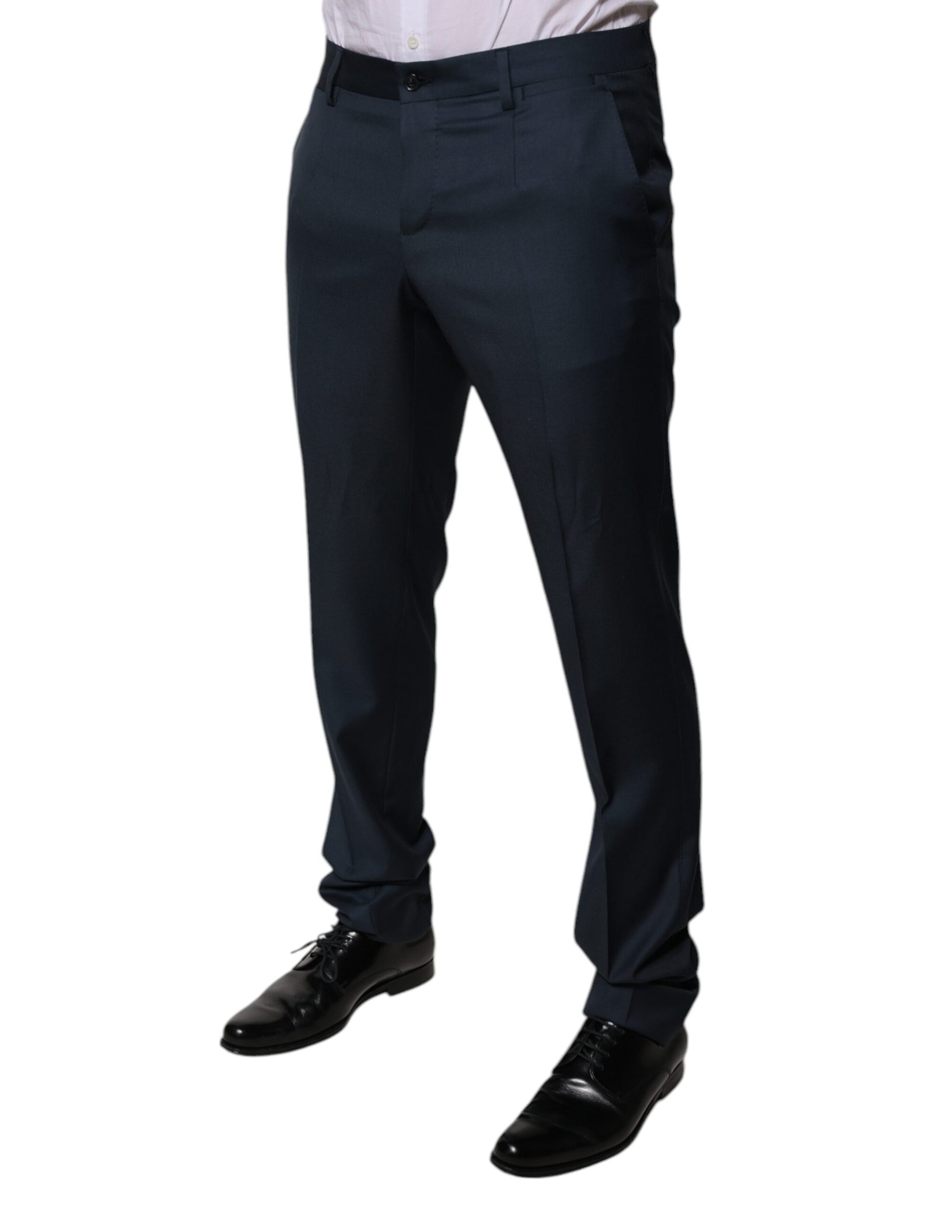 A pair of men's dress pants in a blue wool fabric. They are tapered and have a formal design, suitable for bu