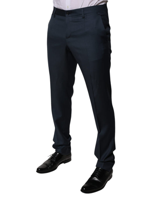 A pair of men's dress pants in a blue wool fabric. They are tapered and have a formal design, suitable for bu