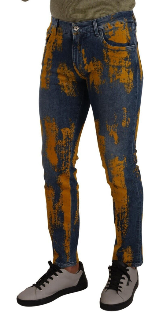 Pair of distressed jeans with yellow stains