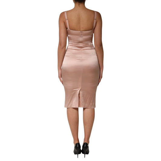 A woman wearing a pink satin bustier dress