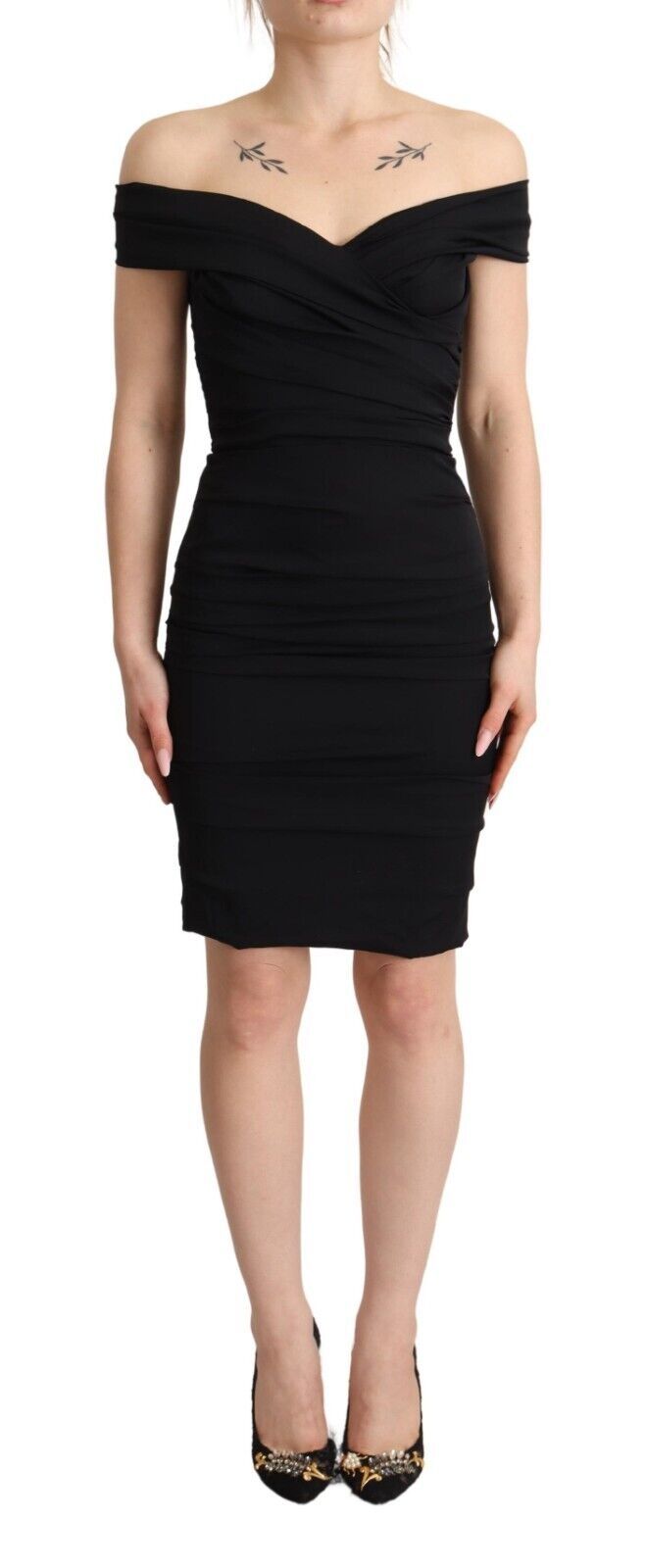 Black dress with ruffled sleeves worn by a woman