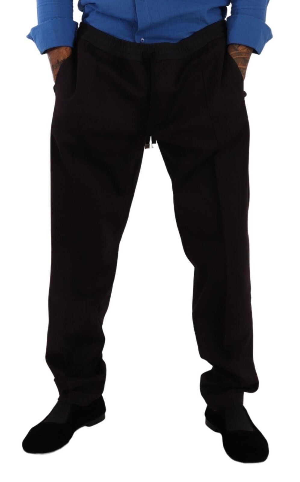 Man wearing black pants and blue shirt