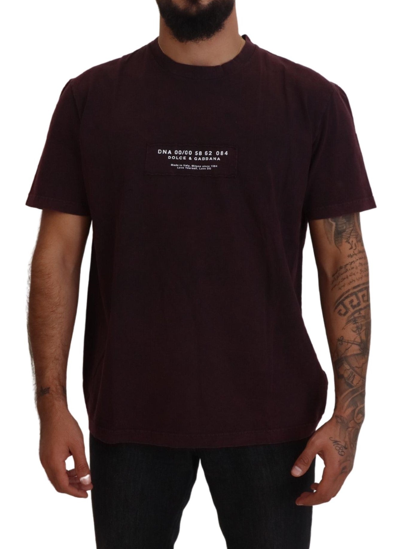 Man wearing dark t-shirt with white text on front