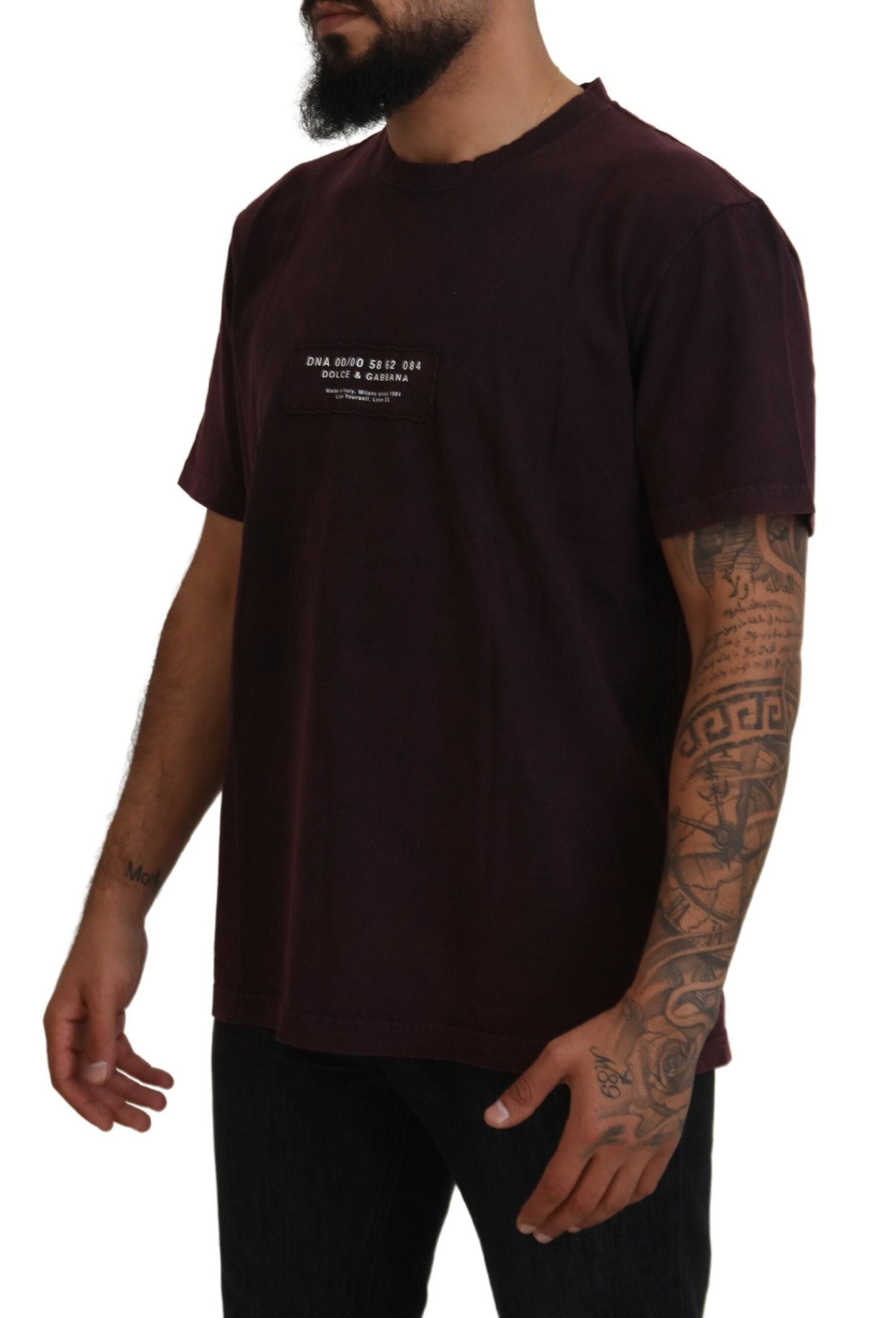 Man wearing dark t-shirt with white graphic on front