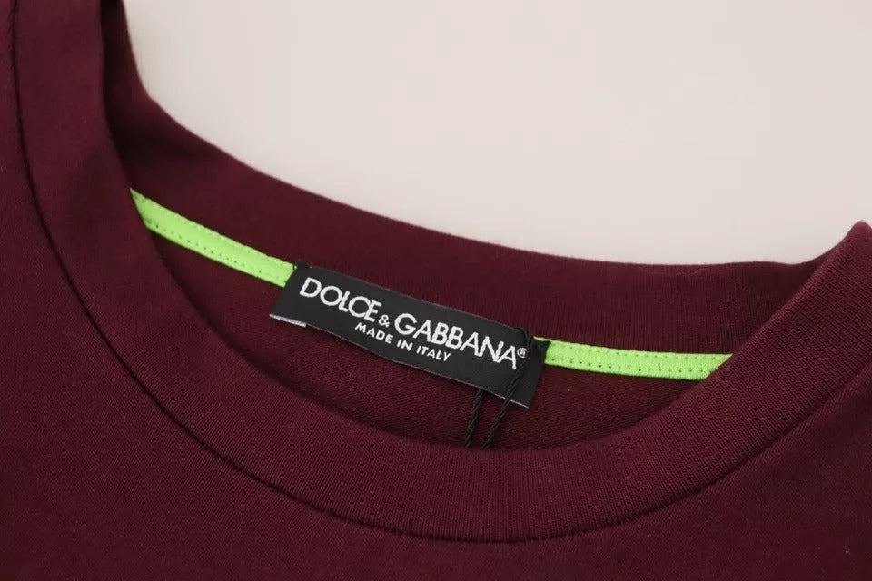 Dark red t-shirt with green trim and brand label