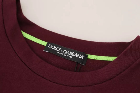 Dark red t-shirt with green trim and brand label