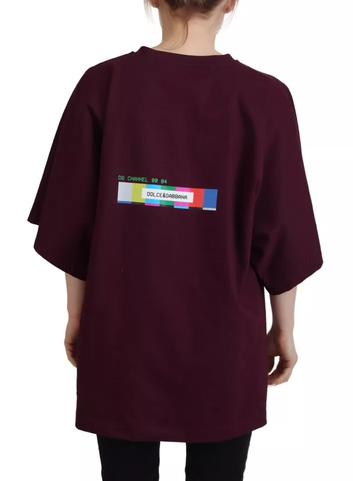 The back of a maroon shirt with a colorful graphic on it