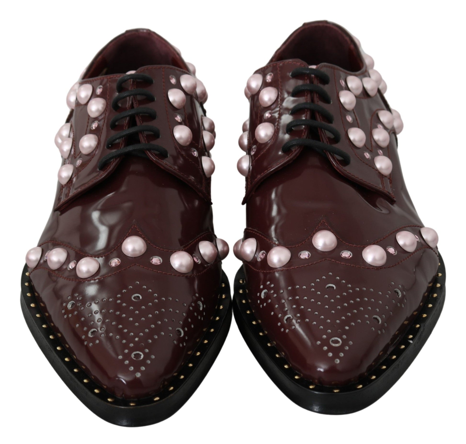 Pair of brown leather shoes with pink pearl embellishments and gold studs