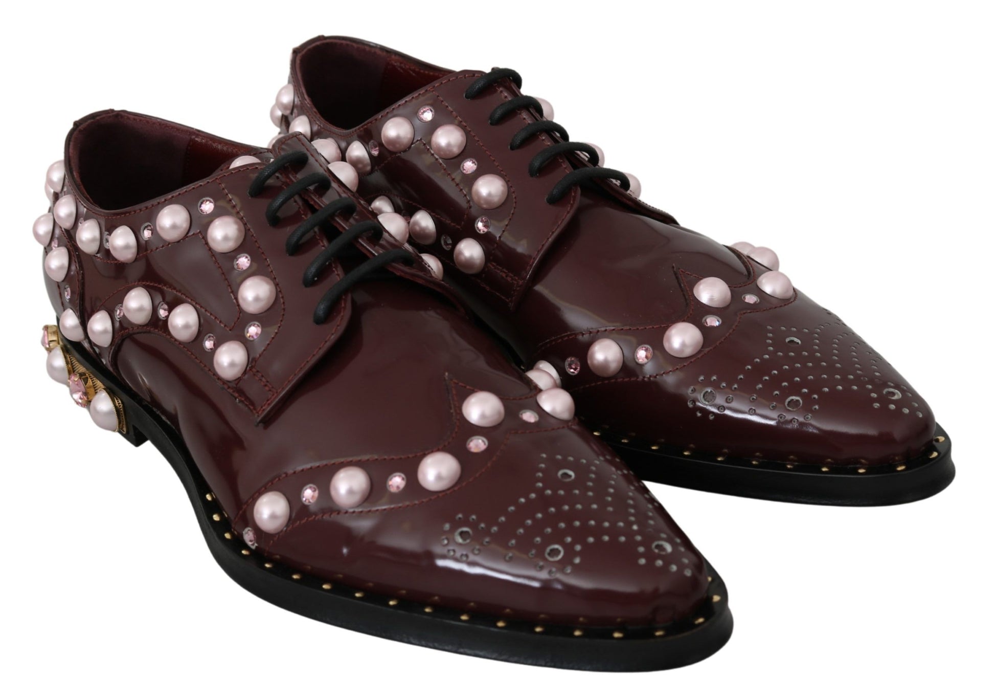 Pair of brown shoes with pearl embellishments and black laces