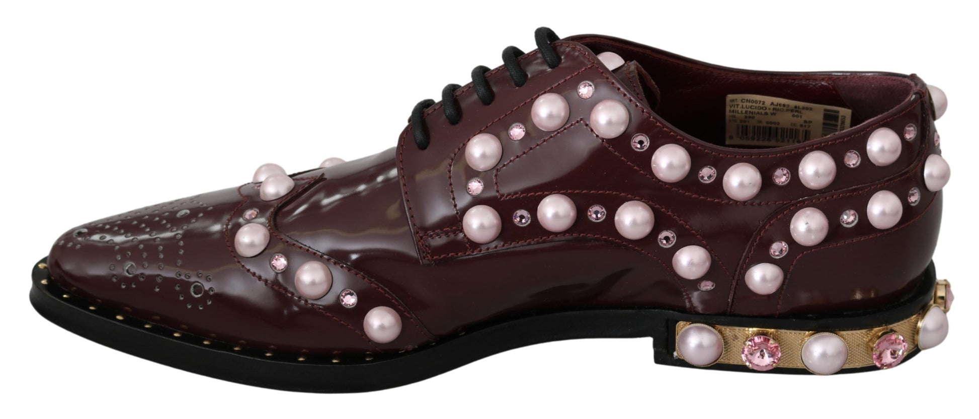 Pair of brown shoes with pearl embellishments and gold accents