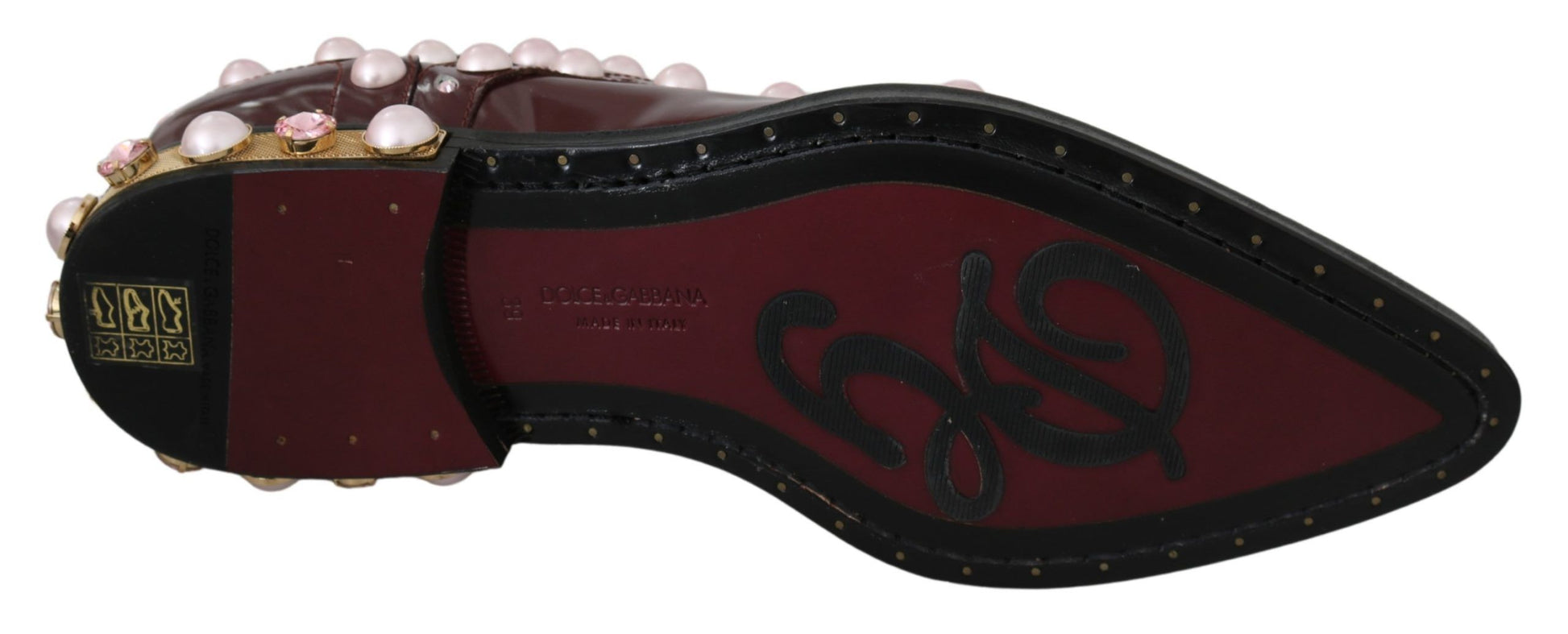 Red shoe with gold accents and pink details