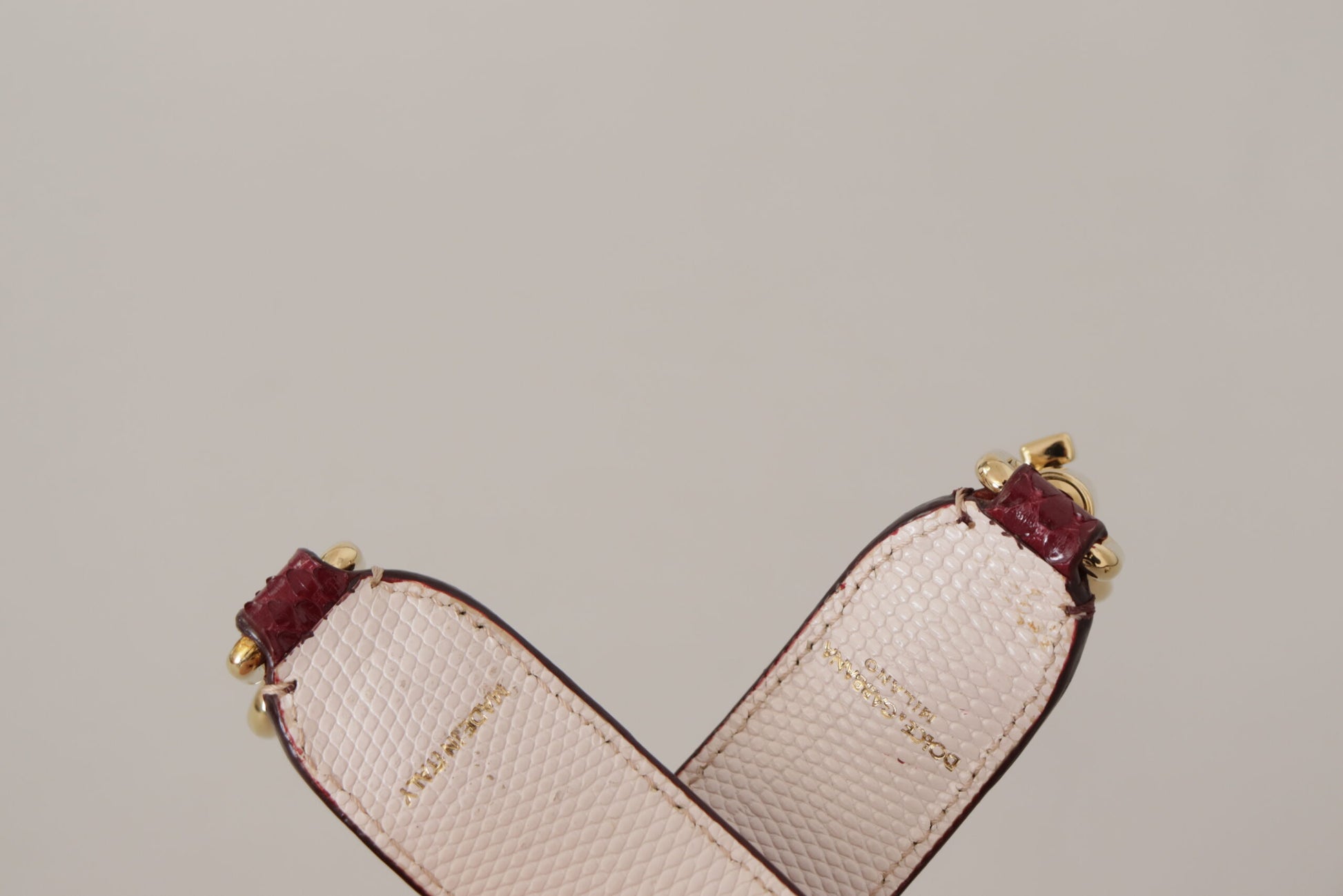 Pink clutch purse with gold accents