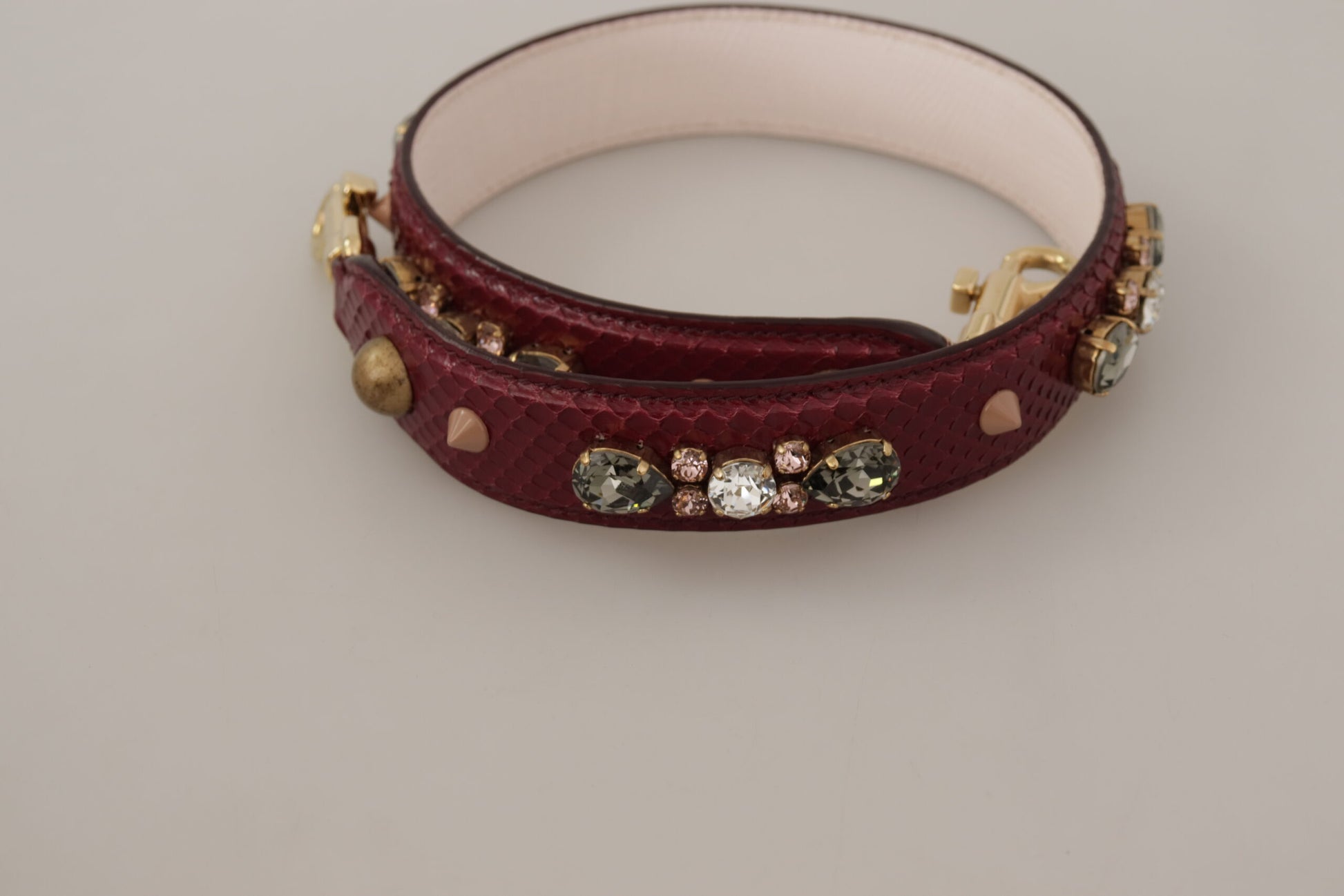 Bracelet with red band and gold accents