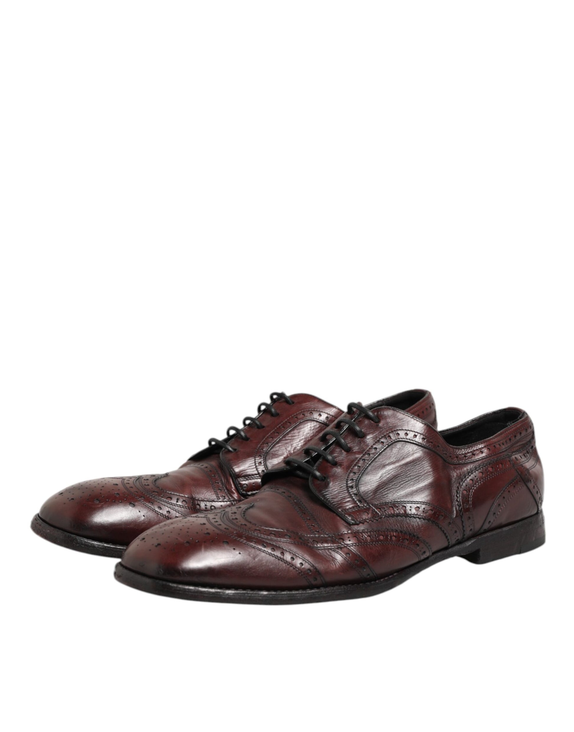Pair of men's dress shoes with laces, in a burgundy leather material