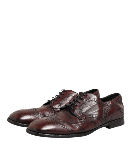 Pair of men's dress shoes with laces, in a burgundy leather material