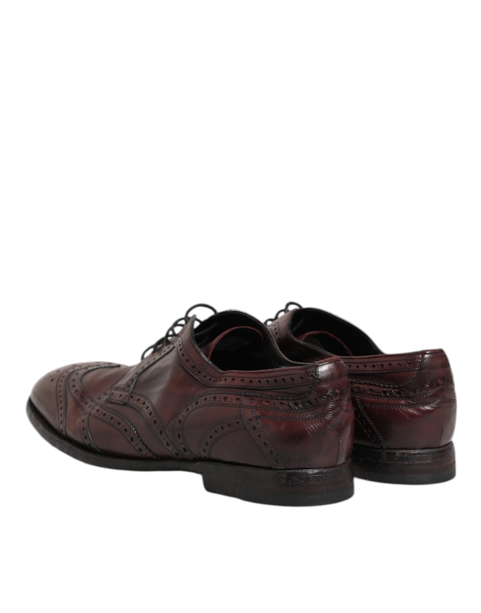 Pair of men's dress shoes with laces, in a burgundy leather material