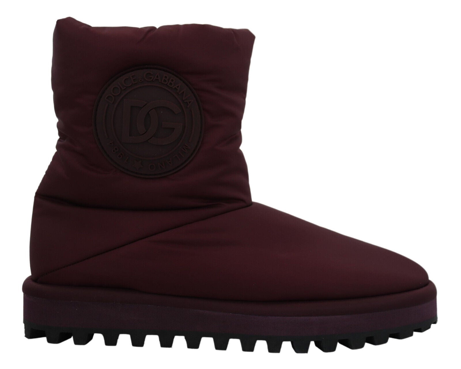 Pair of red boots with a logo on the side