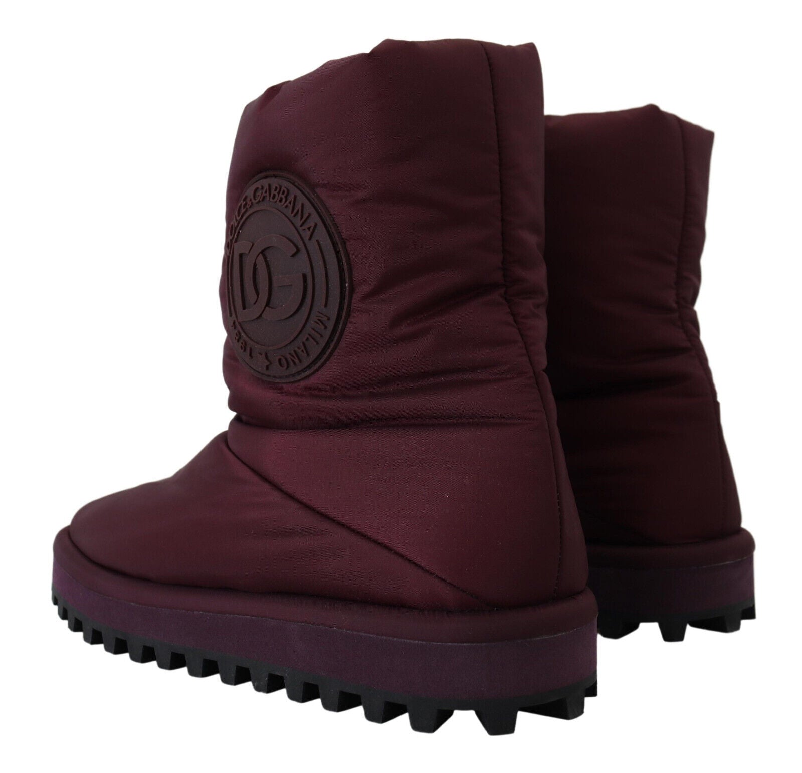 Pair of purple winter boots with a logo on the side