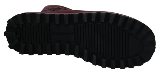 Pair of black and red hiking boots with a deep tread pattern