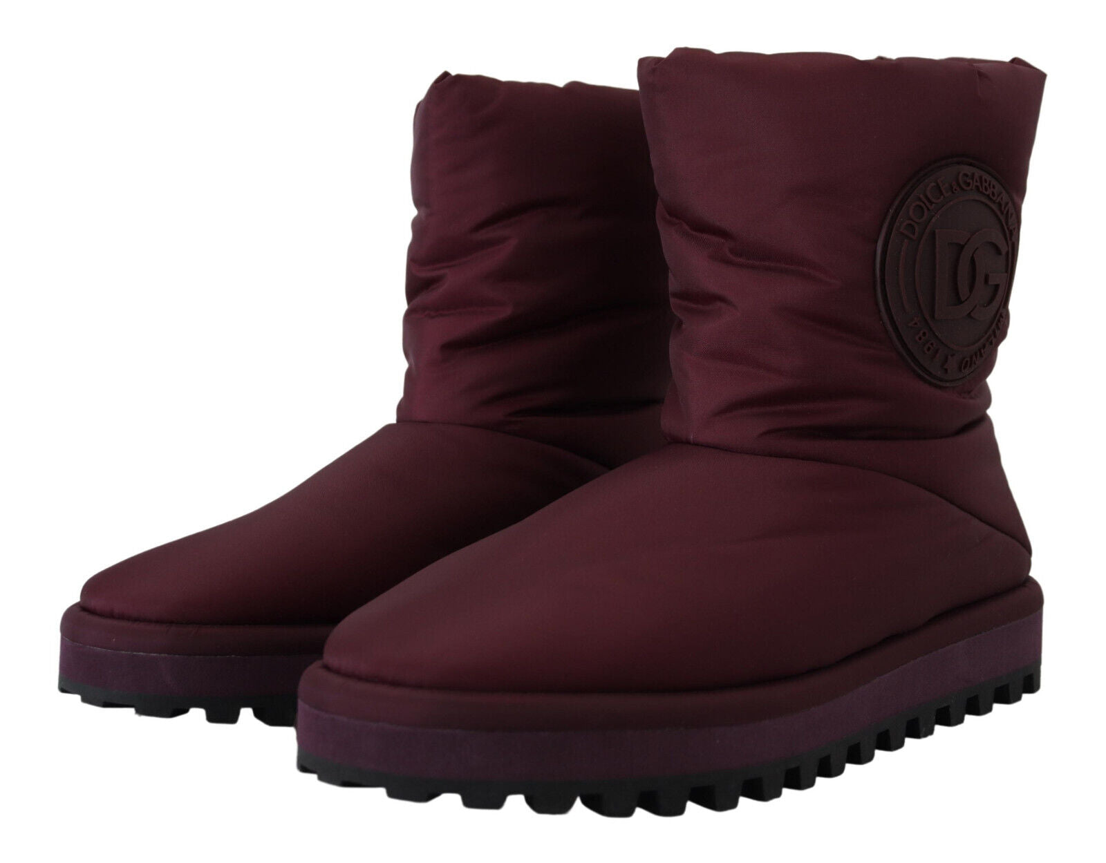 Pair of burgundy boots with white soles and laces