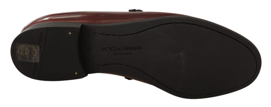 A black and red electric scooter with a visible logo on the side