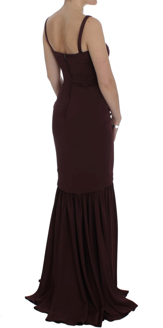 Long sleeveless black dress with ruffles on bottom