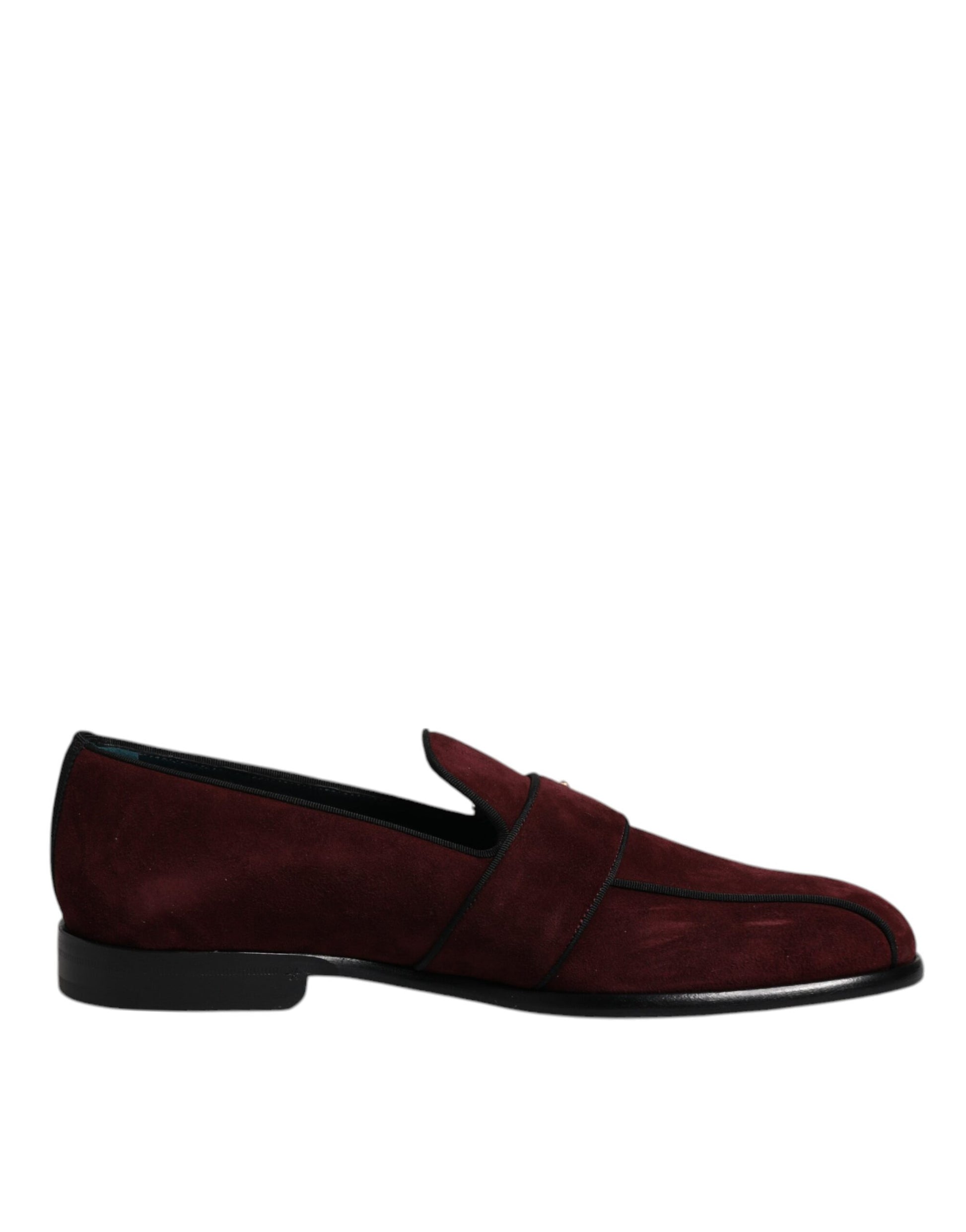 Red suede loafers with black soles, featuring a strap across the top