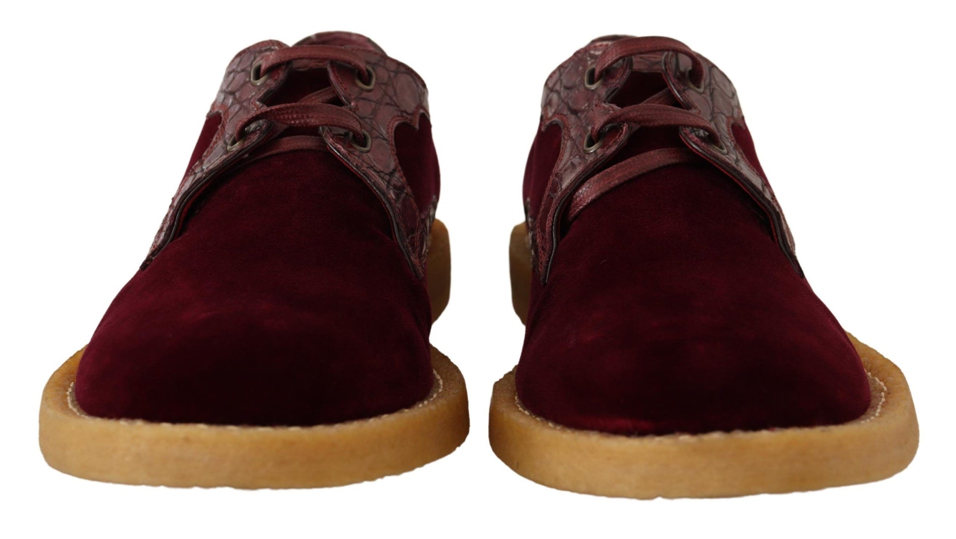 Pair of burgundy velvet shoes with wooden soles and laces