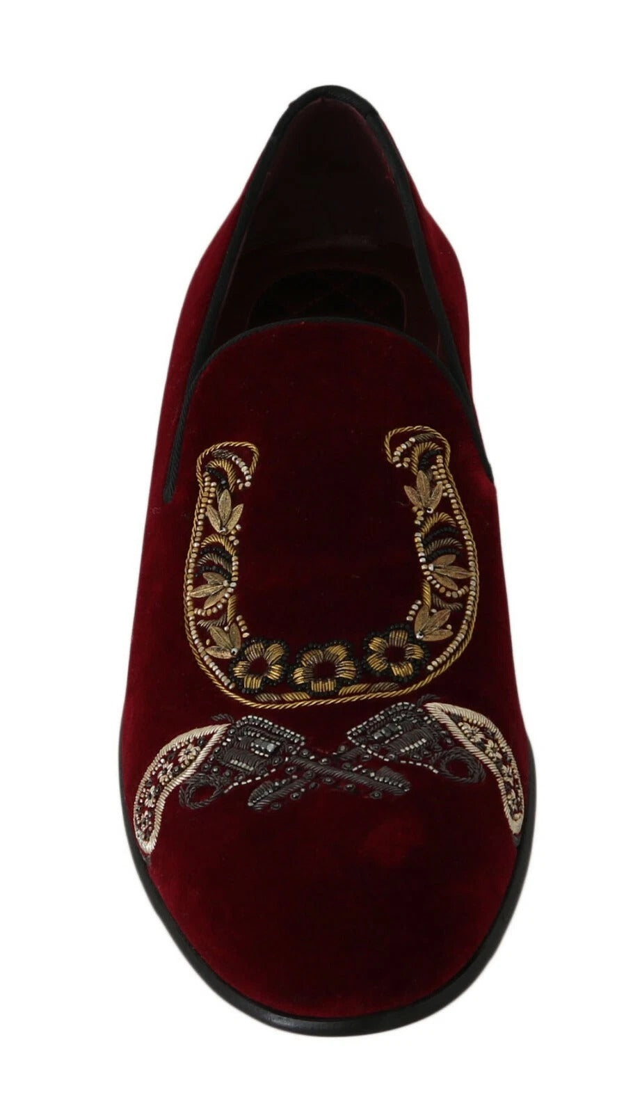 Red velvet slippers with gold embroidery and a horse shoe design on top