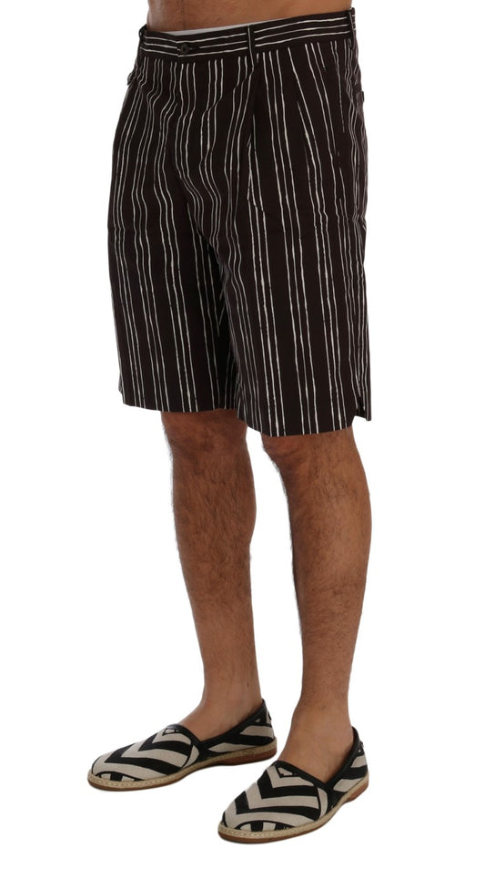 Man wearing striped shorts and sandals