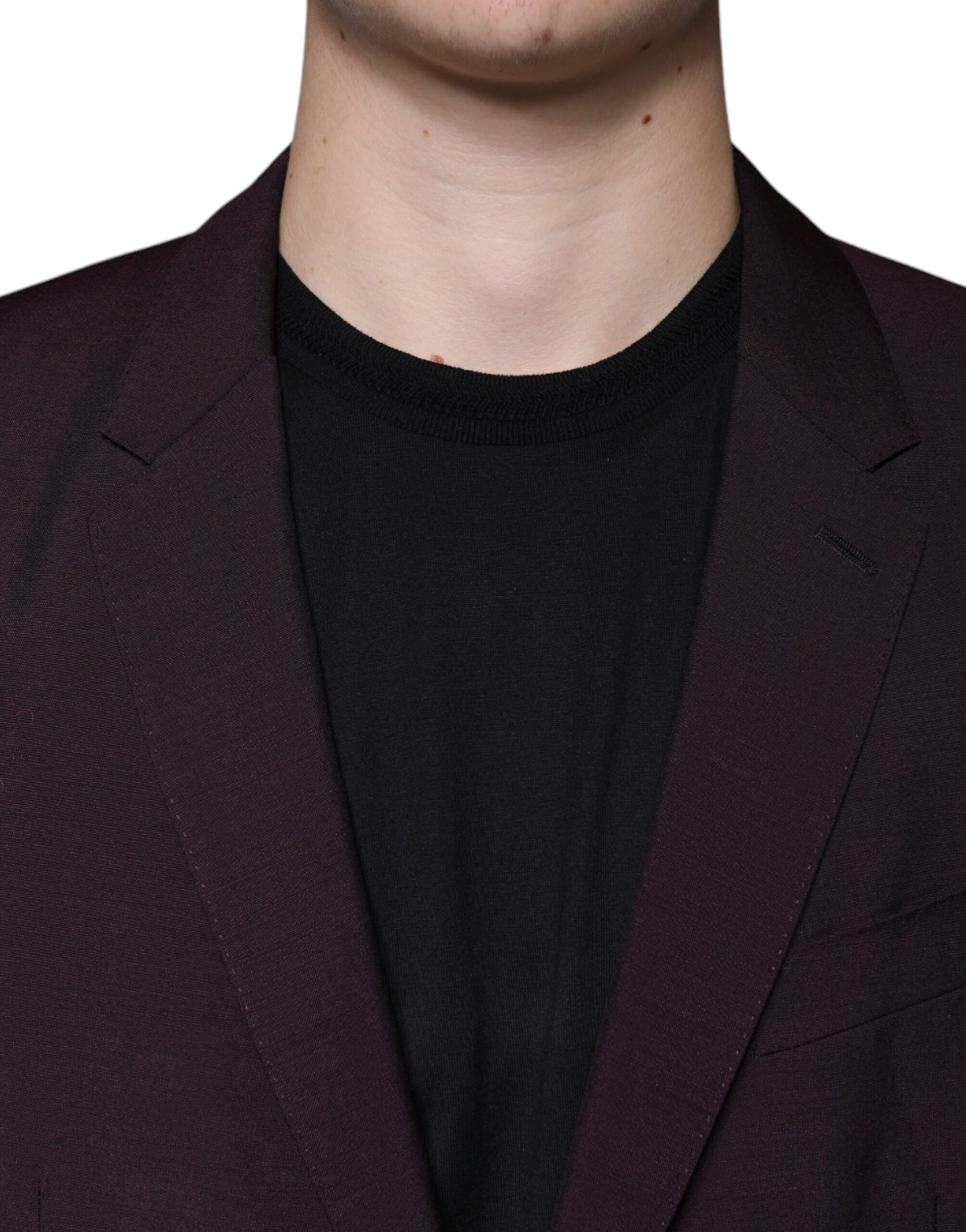 A mannequin wearing a purple blazer with black shirt underneath
